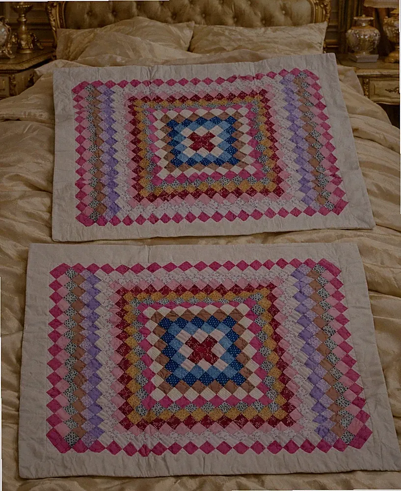 Two quilted patchwork pillow shams, 20" × 26"